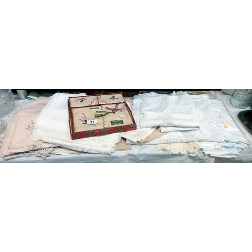 21 - A good lot of linens including tray cloths, table cloths etc