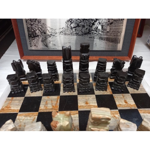 26 - A mixed stone (including onyx) chess board with chess pieces