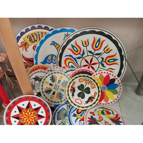 28 - A colourful lot of table mats/coasters plus stainless steel tea set on tray, candlesticks, candles e... 