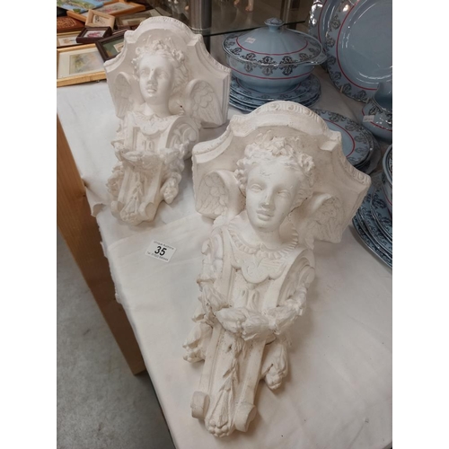 35 - A pair of  plaster figural wall bracket shelves COLLECT ONLY