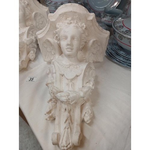 35 - A pair of  plaster figural wall bracket shelves COLLECT ONLY