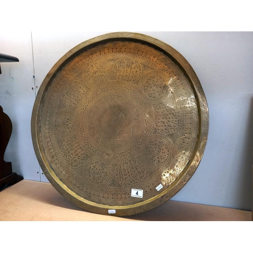 4 - A large brass round tray