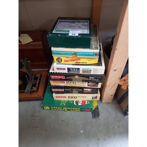 54 - A quantity of jigsaws unchecked including collectors wooden jigsaw, Land ranger map, Bracebridge Hea... 