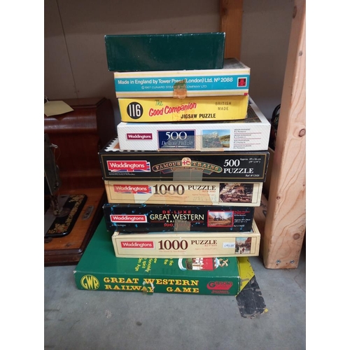 54 - A quantity of jigsaws unchecked including collectors wooden jigsaw, Land ranger map, Bracebridge Hea... 