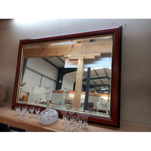 7 - A dark wood framed bevel edge mirror, COLLECT ONLY.