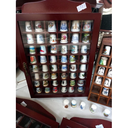 69 - a large collection of thimbles in display cases COLLECT ONLY