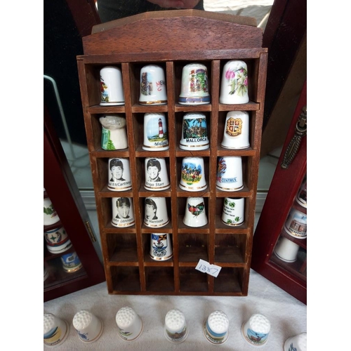 69 - a large collection of thimbles in display cases COLLECT ONLY