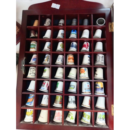 69 - a large collection of thimbles in display cases COLLECT ONLY