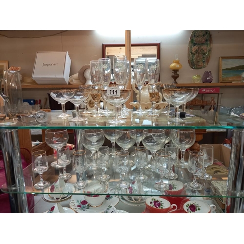 111 - A good lot of drinking glasses on 2 shelves COLLECT ONLY