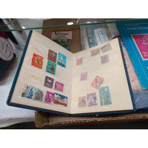 113 - A box of ephemera , sheet music, album of cigarette cards including silks, album of old cheques incl... 