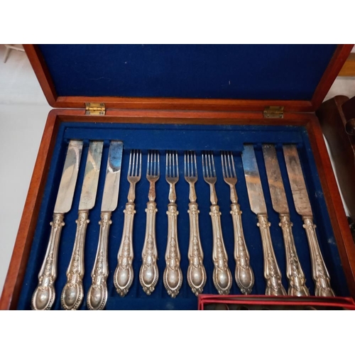 133 - A quantity of cased cutlery etc