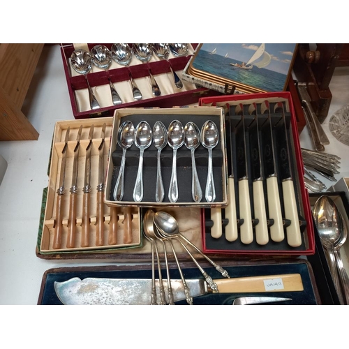 133 - A quantity of cased cutlery etc