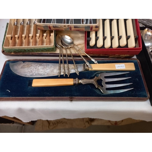 133 - A quantity of cased cutlery etc