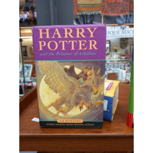 139 - 4 hardback Harry Potter books - Order of the Phoenix is 1st edition other 3 are 10th editions on the... 