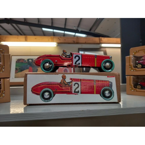 162 - A boxed tin plate clockwork racing car & 8 boxed Corgi & Lledo cars