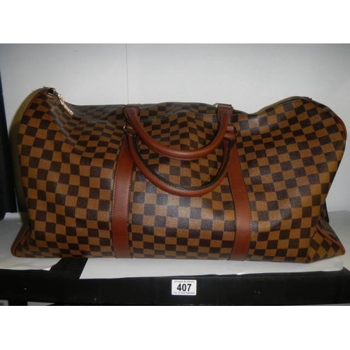 407 - A Louis Viutton style holdall.