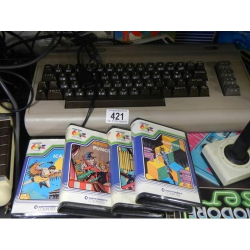 421 - A Commodore console, games etc.,