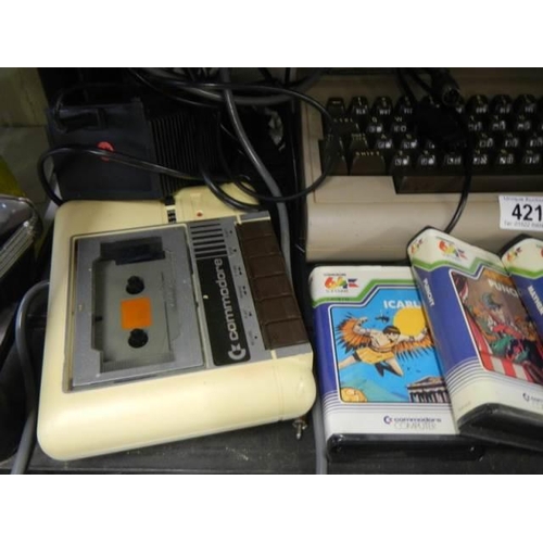 421 - A Commodore console, games etc.,