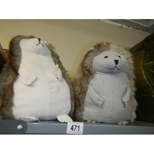 471 - Two heavy hedgehog doorstops. COLLECT ONLY.