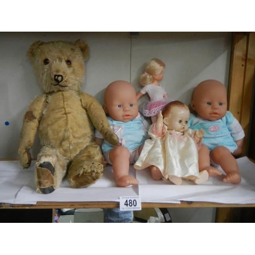 480 - A quantity of vintage dolls and an old teddy bear, a/f.