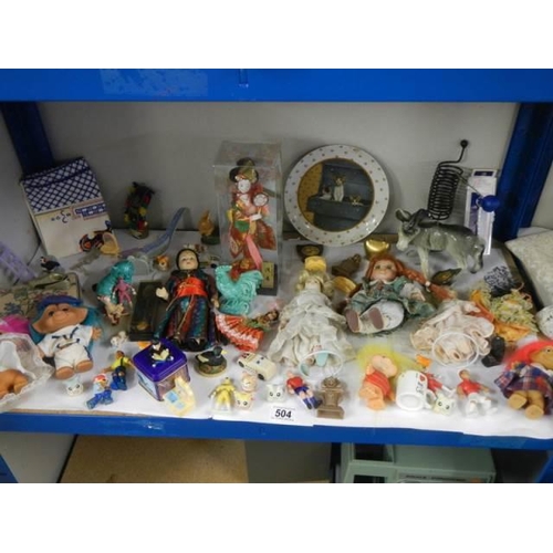 504 - A mixed lot of dolls and toy figures.