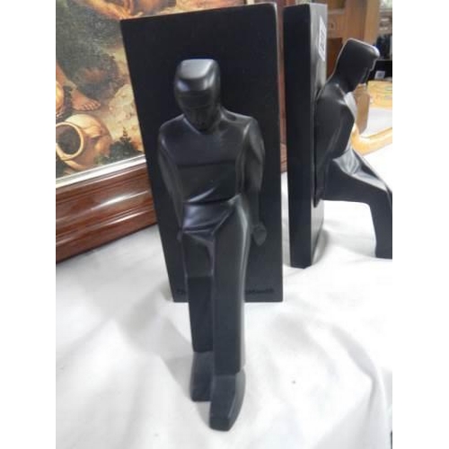 552 - A pair of modern book ends.