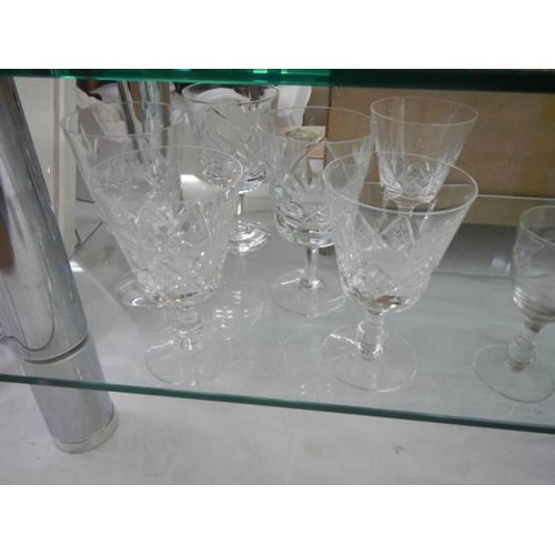 573 - Two shelves of cut glass and other drinking glasses, COLLECT ONLY.