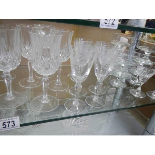 573 - Two shelves of cut glass and other drinking glasses, COLLECT ONLY.