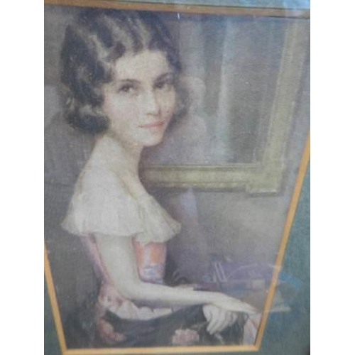 599 - A small portrait print of a young lady in a gilt frame.