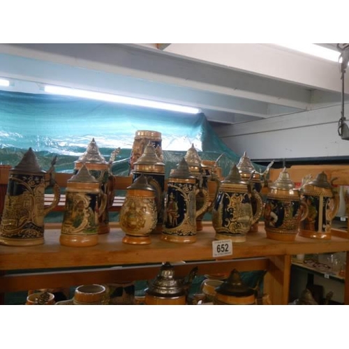 652 - A good shelf of lidded beer steins, COLLECT ONLY.