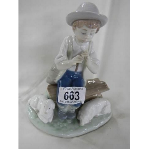 663 - A NAO figure by Lladro of a boy.