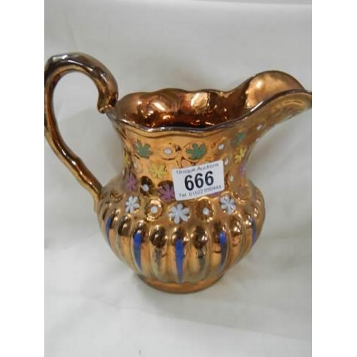 666 - A 19th century copper lustre jug.