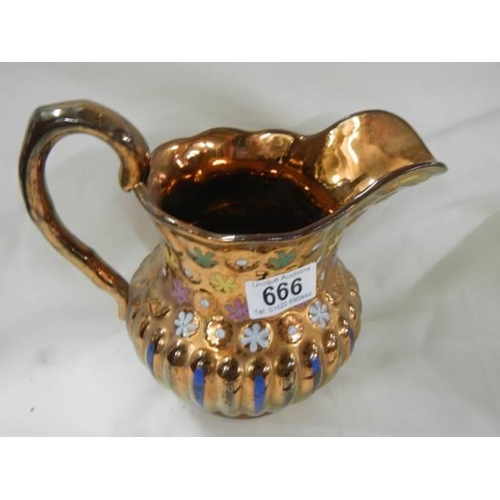 666 - A 19th century copper lustre jug.