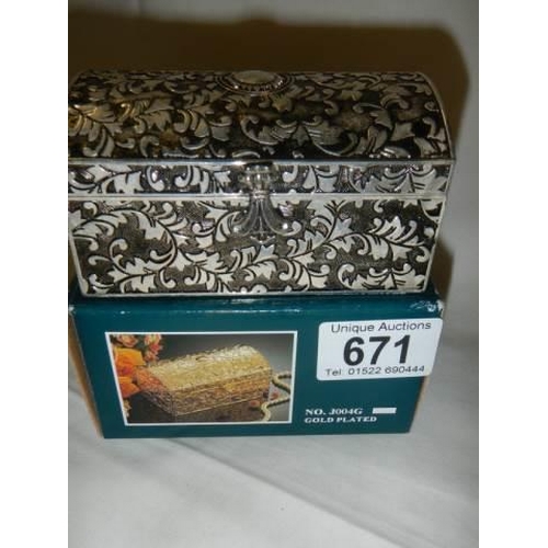 671 - A boxed silver plate trinket box.