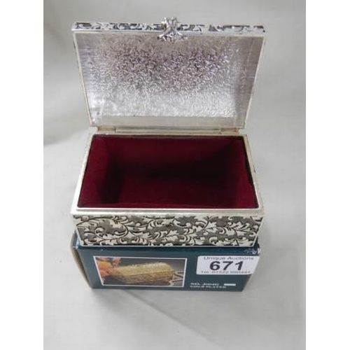 671 - A boxed silver plate trinket box.