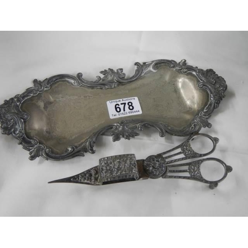 678 - A Victorian plated candle snuffer on tray.