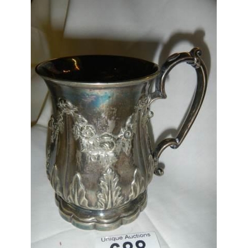 688 - An early 20th century embossed silver plate jug.