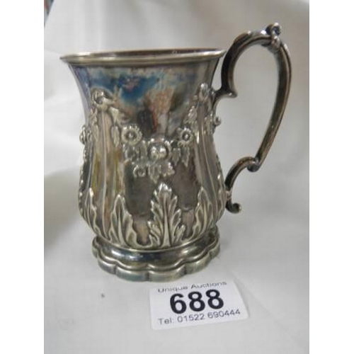 688 - An early 20th century embossed silver plate jug.