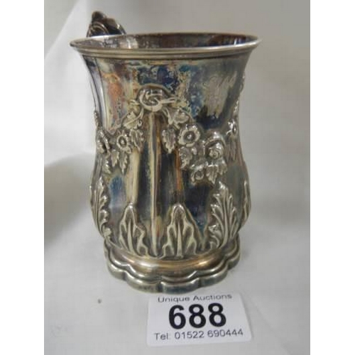 688 - An early 20th century embossed silver plate jug.