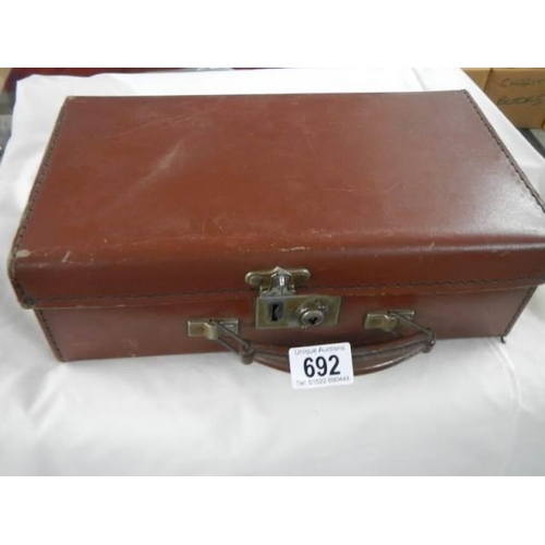 692 - A small suitcase in good condition.