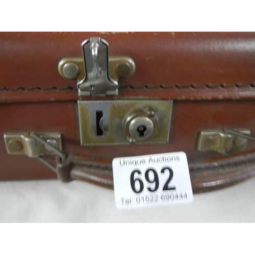 692 - A small suitcase in good condition.