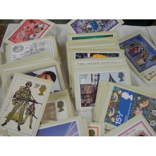 693 - A large lot of Royal Mail postage stamp postcards.