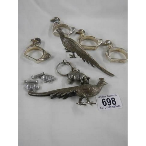 698 - A mixed lot of silver plate including napkin holder, pig etc.,