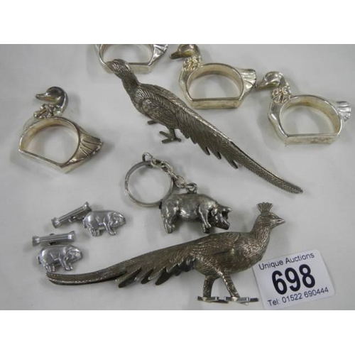 698 - A mixed lot of silver plate including napkin holder, pig etc.,