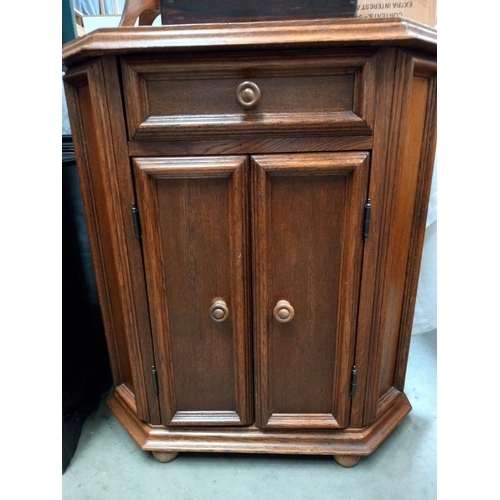 191 - An oak veneered 2 door, 1 drawer cupboard COLLECT ONLY