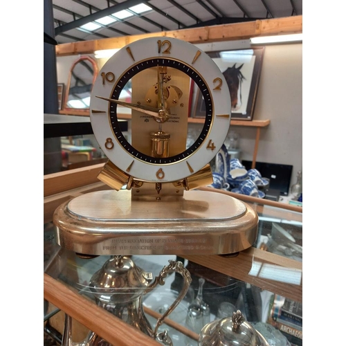 243 - A Junghans magnetic balance wheel clock, small chip in glass dome and will need new batteries COLLEC... 