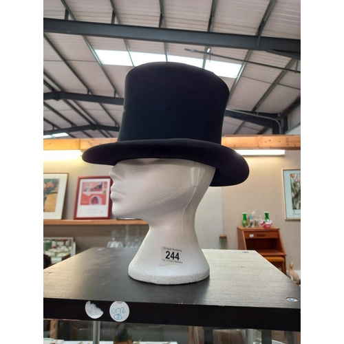 244 - A vintage Hope brothers London top hat, some discolouration to parts of hat