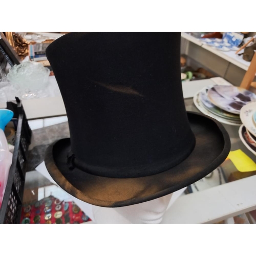 244 - A vintage Hope brothers London top hat, some discolouration to parts of hat