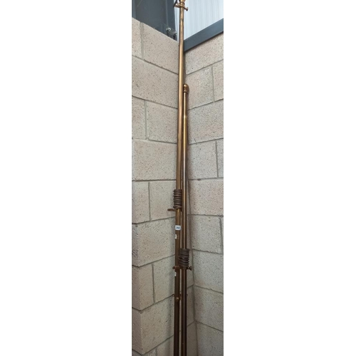 268 - 2 brass coloured curtain poles with rings, length 227cm and 287cm COLLECT ONLY