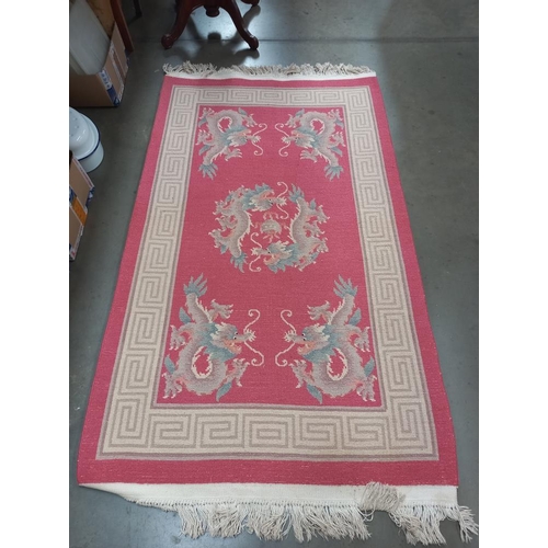 283 - A pink rug 150cm x 90cm approx COLLECT ONLY